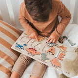 Engraved dinosaur name puzzle – wooden activity board for toddlers