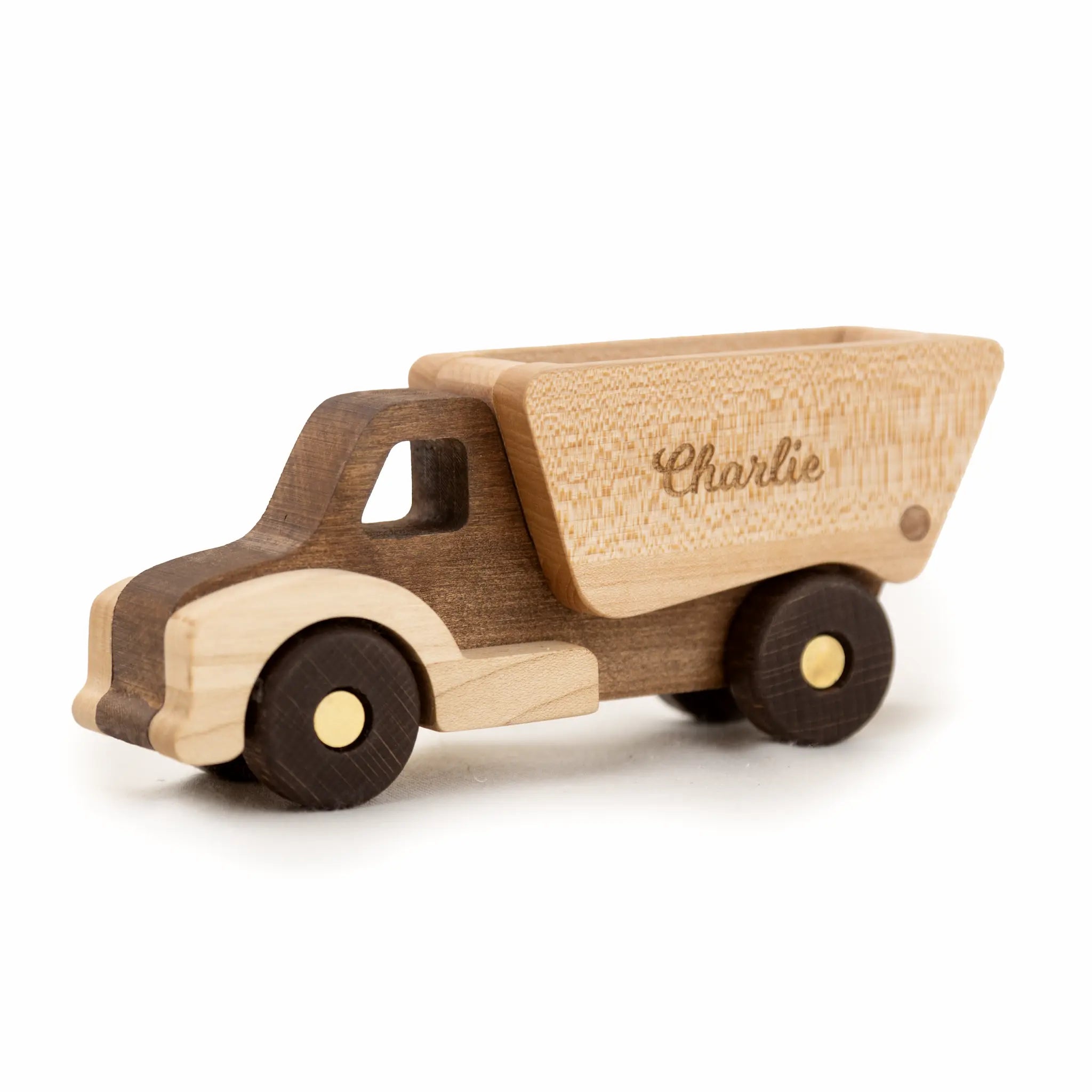 Wooden toy truck with name engraving on a white background