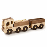 Wooden toy truck with a trailer on a white background