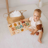 Child playing with a wooden name puzzle 