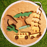 Wooden toy set with animals and a tree on a round wooden board.