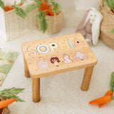 Wooden stool with a name on a white carpet