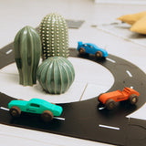 Toy cars on a track.