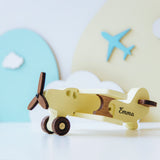 Yellow personalized wooden toy plane with cloud decoration background