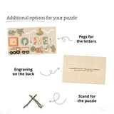 Wooden puzzle with engraved name and additional components on a white background.